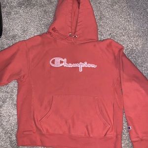 Pink/coral champion hoodie in a size large kids